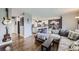 Comfortable living room showcasing hardwood floors and an open layout to the kitchen at 3378 Mowry Pl, Westminster, CO 80031