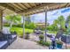 Beautiful outdoor patio with stone pavers, comfortable seating, and well manicured lawn at 3378 Mowry Pl, Westminster, CO 80031