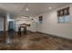 Finished basement with a kitchenette, polished floors, and natural light, ideal for entertaining at 1260 Hudson St, Denver, CO 80220