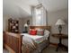 Comfortable bedroom featuring warm wood furnishings, soft natural light, and stylish décor at 1260 Hudson St, Denver, CO 80220