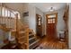 Welcoming entryway with hardwood floors, staircase, and wooden accents throughout at 1260 Hudson St, Denver, CO 80220