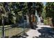 Charming home with a fenced yard, driveway, and beautifully landscaped front yard at 1260 Hudson St, Denver, CO 80220