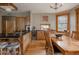 Kitchen with long breakfast bar and dining area with view of backyard at 1260 Hudson St, Denver, CO 80220