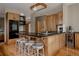 Spacious kitchen island with countertop seating and black appliances at 1260 Hudson St, Denver, CO 80220