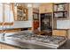 Kitchen with gas range and black countertops at 1260 Hudson St, Denver, CO 80220