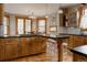 Bright kitchen with custom cabinets, granite countertops, and stainless steel appliances at 1260 Hudson St, Denver, CO 80220