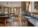 Kitchen with breakfast bar and dining area with view of backyard at 1260 Hudson St, Denver, CO 80220