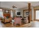 Cozy living room with a fireplace, hardwood floors, and comfortable seating at 1260 Hudson St, Denver, CO 80220