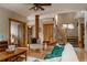 Spacious living room with hardwood floors, a ceiling fan, and stylish furnishings at 1260 Hudson St, Denver, CO 80220
