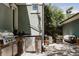 Inviting outdoor kitchen with stainless steel grill, mini fridge, and stone accents, ideal for entertaining at 1260 Hudson St, Denver, CO 80220