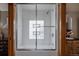 Shower stall with glass door features tile surround and provides access to bathing fixtures at 1260 Hudson St, Denver, CO 80220