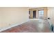 A view of the living room with old wood floors and walls that are showing wear at 14624 County Road 12, Fort Lupton, CO 80621