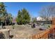 Large backyard with a fenced garden area, and a mature tree at 5241 E 128Th Way, Thornton, CO 80241