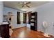 Bedroom with hardwood floors, and a cat tree for your furry friends to enjoy at 5241 E 128Th Way, Thornton, CO 80241