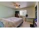 Bedroom with light green walls, ceiling fan and a window at 5241 E 128Th Way, Thornton, CO 80241