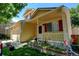 Quaint front porch with a decorative garden bed adds character to this lovely two-story home at 5241 E 128Th Way, Thornton, CO 80241
