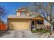 Charming two-story home with a two-car garage and front porch at 5241 E 128Th Way, Thornton, CO 80241