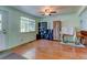 Bright room with hardwood floors, featuring a large window, and plenty of storage and seating at 5241 E 128Th Way, Thornton, CO 80241