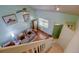 Sunlit living room features soaring ceilings, a cozy sofa, and elegant hardwood floors at 5241 E 128Th Way, Thornton, CO 80241