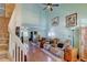Spacious living room with high ceilings, hardwood floors, and a comfortable seating area at 5241 E 128Th Way, Thornton, CO 80241