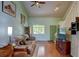 Bright living room with vaulted ceilings, hardwood floors, and a comfortable sofa at 5241 E 128Th Way, Thornton, CO 80241