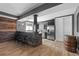 Finished basement bar area featuring stone accents, wooden bar top, and stainless steel appliances at 696 Eveningsong Dr, Castle Rock, CO 80104