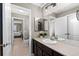 Bathroom with vanity, mirror, and views into the bedroom and shower at 696 Eveningsong Dr, Castle Rock, CO 80104