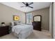 Cozy bedroom with neutral tones, carpeted floor, and dresser at 696 Eveningsong Dr, Castle Rock, CO 80104