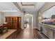 Grand entryway with hardwood floors and views to the staircase and dining area at 696 Eveningsong Dr, Castle Rock, CO 80104