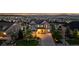 Inviting home with manicured lawn, long driveway, and stunning city and mountain views at 696 Eveningsong Dr, Castle Rock, CO 80104