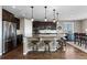 Well-appointed kitchen with stainless steel appliances, granite countertops, pendant lighting, and a convenient breakfast bar at 696 Eveningsong Dr, Castle Rock, CO 80104