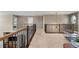 Spacious loft area with open railing overlooking the staircase and main level at 696 Eveningsong Dr, Castle Rock, CO 80104