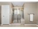 Clean modern main bath shower with glass door and chrome fixtures at 696 Eveningsong Dr, Castle Rock, CO 80104