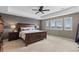Primary bedroom with tray ceiling and plantation shutters at 696 Eveningsong Dr, Castle Rock, CO 80104
