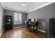 Comfortable office space with dark wood floors and ample natural light at 696 Eveningsong Dr, Castle Rock, CO 80104
