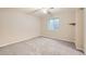 Spacious basement bedroom with ceiling fan and window at 5353 Royal Pine St, Brighton, CO 80601