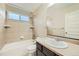 Clean bathroom with tub, shower, and single vanity at 5353 Royal Pine St, Brighton, CO 80601