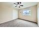 Spacious bedroom featuring a ceiling fan and large window at 5353 Royal Pine St, Brighton, CO 80601