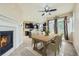 Kitchen and dining area with hardwood floors, an island, and access to the backyard at 5353 Royal Pine St, Brighton, CO 80601