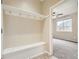 Laundry room with washer, dryer, and built-in shelving at 5353 Royal Pine St, Brighton, CO 80601