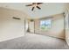 Main bedroom with carpeted floor and window with view at 5353 Royal Pine St, Brighton, CO 80601