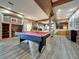 Finished basement with a pool table, fireplace, and an open floor plan at 6533 S Quemoy Way, Aurora, CO 80016