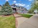 Charming two-story home with a manicured lawn and a three-car garage at 6533 S Quemoy Way, Aurora, CO 80016