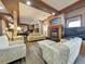 Spacious living room with a fireplace, comfortable seating, hardwood floors, and stylish decor at 6533 S Quemoy Way, Aurora, CO 80016