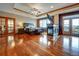 Luxurious main bedroom suite with a fireplace, hardwood floors, and natural light at 6533 S Quemoy Way, Aurora, CO 80016