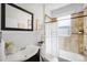 Cozy bathroom featuring neutral tiles, a shower, a bathtub, and a sleek vanity at 122 N Logan St, Denver, CO 80203