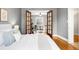 Sunlit bedroom boasts beautiful french doors leading to the cozy living area at 122 N Logan St, Denver, CO 80203