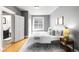 Inviting bedroom boasting a window, a soft rug, and a comfortable, stylish bed at 122 N Logan St, Denver, CO 80203