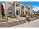 Beautiful townhome exteriors with well-maintained landscaping and inviting front entrances at 122 N Logan St, Denver, CO 80203