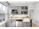 Modern kitchen featuring sleek cabinetry, granite countertops, a stainless steel dishwasher and microwave at 122 N Logan St, Denver, CO 80203